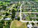 Expansive aerial view showcases a well-planned residential community with lush greenery at 2240 Country Manor St, Bartow, FL 33830