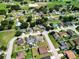 Wide aerial view of a suburban neighborhood featuring well-maintained homes and green spaces at 2240 Country Manor St, Bartow, FL 33830