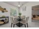 Cozy dining area with a round table, stylish chairs, and natural light at 2240 Country Manor St, Bartow, FL 33830