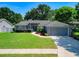 Charming single-story home with a well-maintained lawn and inviting front entrance at 2240 Country Manor St, Bartow, FL 33830