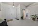 Bright and airy foyer featuring tiled floors, double front doors, and a decorative mirror at 2240 Country Manor St, Bartow, FL 33830