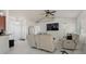Open-concept living room with tile flooring, a ceiling fan, and access to other areas at 2240 Country Manor St, Bartow, FL 33830
