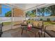 Screened in patio with outdoor seating and view of the fenced in backyard at 2240 Country Manor St, Bartow, FL 33830
