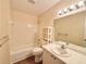 Bathroom showcasing a tub-shower combo and large mirror at 254 Winter Ridge Blvd # 254, Winter Haven, FL 33881