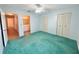 Bedroom with ceiling fan, closets, and adjoining bathroom at 254 Winter Ridge Blvd # 254, Winter Haven, FL 33881