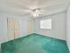 Bright bedroom with window, ceiling fan, and closet at 254 Winter Ridge Blvd # 254, Winter Haven, FL 33881