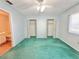 Bedroom with ceiling fan and open closets, offering ample space at 254 Winter Ridge Blvd # 254, Winter Haven, FL 33881