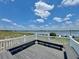 Community deck overlooking the lake with benches and a scenic view at 254 Winter Ridge Blvd # 254, Winter Haven, FL 33881