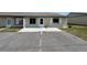 Inviting townhome featuring a private patio, dedicated parking spaces, and classic architectural design at 254 Winter Ridge Blvd # 254, Winter Haven, FL 33881