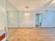 Inviting living room with wood flooring, neutral walls, a chandelier, and an open doorway at 254 Winter Ridge Blvd # 254, Winter Haven, FL 33881