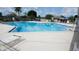 Community pool with lounge chairs and a pristine pool at 254 Winter Ridge Blvd # 254, Winter Haven, FL 33881