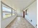 Bright sunroom featuring tiled floor, several windows, and lots of natural light at 254 Winter Ridge Blvd # 254, Winter Haven, FL 33881