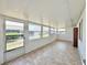 Bright sunroom featuring tiled floor, several windows, and lots of natural light at 254 Winter Ridge Blvd # 254, Winter Haven, FL 33881