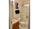 The bathroom features a shower-tub combination with glass door and a vanity with cabinet at 263 Reserve Dr, Davenport, FL 33896