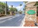 Towncenter Resort entrance with stone gate, lush landscaping, and black iron fence create an inviting atmosphere at 263 Reserve Dr, Davenport, FL 33896