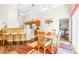 Cozy dining area off of the kitchen featuring hardwood floors, light walls, and a ceiling fan at 263 Reserve Dr, Davenport, FL 33896
