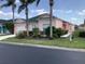 Charming one-story home with manicured landscaping, a two-car garage, and a welcoming entrance at 263 Reserve Dr, Davenport, FL 33896
