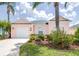 Charming single Gathering home in a lush landscaped yard with a garage at 263 Reserve Dr, Davenport, FL 33896