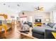 Inviting living room with vaulted ceiling, ceiling fans, and hardwood floors is perfect for entertaining at 263 Reserve Dr, Davenport, FL 33896