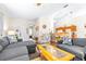 Comfortable living room with vaulted ceiling, ceiling fans, hardwood floors is perfect for relaxing at 263 Reserve Dr, Davenport, FL 33896