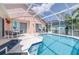 Inviting screened-in pool with outdoor seating, perfect for relaxation and entertaining at 263 Reserve Dr, Davenport, FL 33896