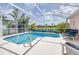 Inviting screened-in pool with outdoor seating, perfect for relaxation and entertaining at 263 Reserve Dr, Davenport, FL 33896