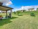 Spacious backyard with covered patio perfect for outdoor entertaining and relaxing at 278 Alford Dr, Davenport, FL 33896