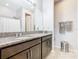 Modern bathroom with granite countertops, sleek cabinetry, and a large mirror at 278 Alford Dr, Davenport, FL 33896