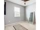 Bedroom with neutral walls, a ceiling fan, and a full-length mirror at 278 Alford Dr, Davenport, FL 33896