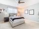 Comfortable bedroom featuring neutral decor, ceiling fan, and ample natural light at 278 Alford Dr, Davenport, FL 33896