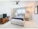 Bright bedroom with a large bed, side tables, and stylish decorative items at 278 Alford Dr, Davenport, FL 33896