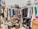 Walk-in closet filled with clothing and shoe racks, offering ample storage space at 278 Alford Dr, Davenport, FL 33896