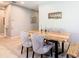 Cozy dining area features a unique wooden table, elegant chairs, and stylish decor at 278 Alford Dr, Davenport, FL 33896