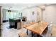 View of open concept kitchen and dining area, featuring granite countertops and barstool seating at 278 Alford Dr, Davenport, FL 33896