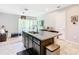 Bright kitchen boasts granite countertops, stainless steel sink, and seamless flow to the living area at 278 Alford Dr, Davenport, FL 33896