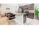 Stylish kitchen with stainless steel appliances, granite countertops, and dark cabinetry for a modern aesthetic at 278 Alford Dr, Davenport, FL 33896