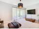 Bright living room features sliding doors to the patio and modern decor at 278 Alford Dr, Davenport, FL 33896