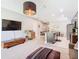 Open concept living area connecting to the kitchen and dining space with modern design elements at 278 Alford Dr, Davenport, FL 33896