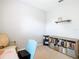 Bright office space with a bookshelf, chair, and wooden shelving at 278 Alford Dr, Davenport, FL 33896