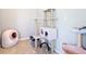 Pet room equipped with a multi-level cat tree, a self-cleaning litter box, and various toys at 278 Alford Dr, Davenport, FL 33896