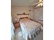 Bright bedroom featuring a comfortable bed, a ceiling fan, and neutral-toned walls at 2909 Pine Tree Dr, Edgewater, FL 32141