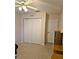 Bedroom featuring neutral carpet and a large closet with a door leading to another room at 2909 Pine Tree Dr, Edgewater, FL 32141