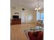 Spacious living room with vaulted ceiling, hardwood floors, and access to other areas of the home at 2909 Pine Tree Dr, Edgewater, FL 32141