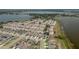 Aerial view showing homes for sale in a residential neighborhood near a large lake at 299 Winter Ridge Blvd # 299, Winter Haven, FL 33881