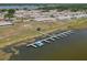 Aerial view of houses near the water featuring a boat dock and lake at 299 Winter Ridge Blvd # 299, Winter Haven, FL 33881