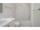 Clean, tiled bathroom featuring a shower-tub combo and classic fixtures at 299 Winter Ridge Blvd # 299, Winter Haven, FL 33881