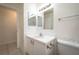 Simple, well-lit bathroom features a clean vanity and a mirrored wall cabinet at 299 Winter Ridge Blvd # 299, Winter Haven, FL 33881