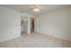 Neutral bedroom with tile flooring; bathroom and kitchen access adds convenience at 299 Winter Ridge Blvd # 299, Winter Haven, FL 33881