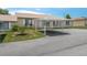 Inviting single-story home featuring a convenient carport and well-maintained landscaping at 299 Winter Ridge Blvd # 299, Winter Haven, FL 33881