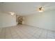 Expansive living area with tile flooring, seamlessly flowing into the kitchen and dining spaces at 299 Winter Ridge Blvd # 299, Winter Haven, FL 33881